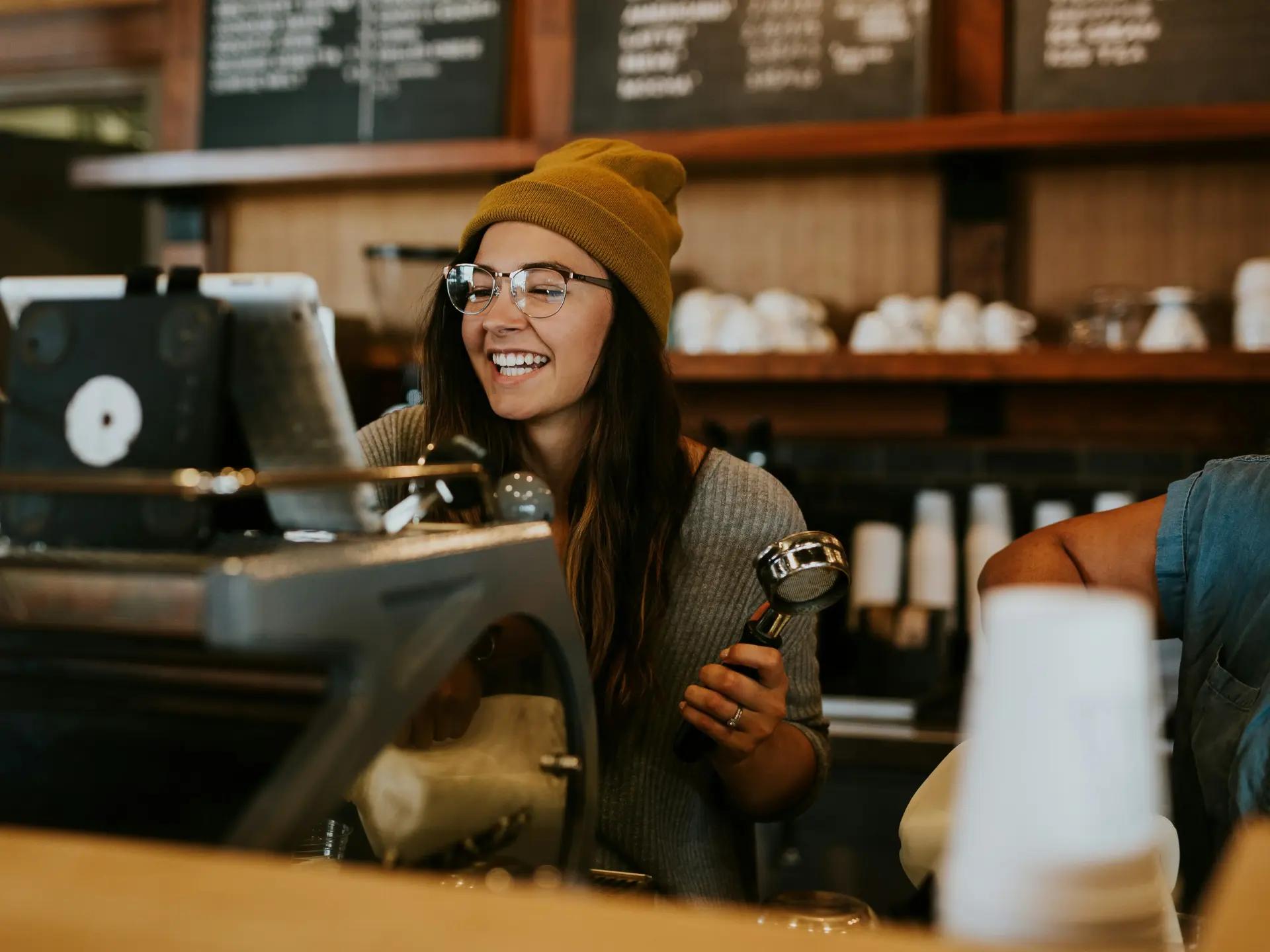 A restaurant team member at a café counter