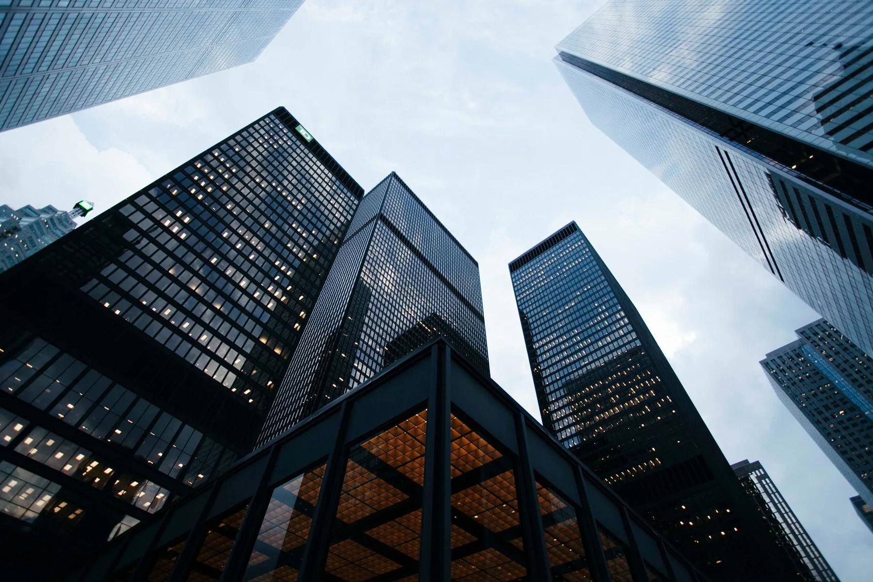 Tall buildings viewed from below, representing ambition and scale