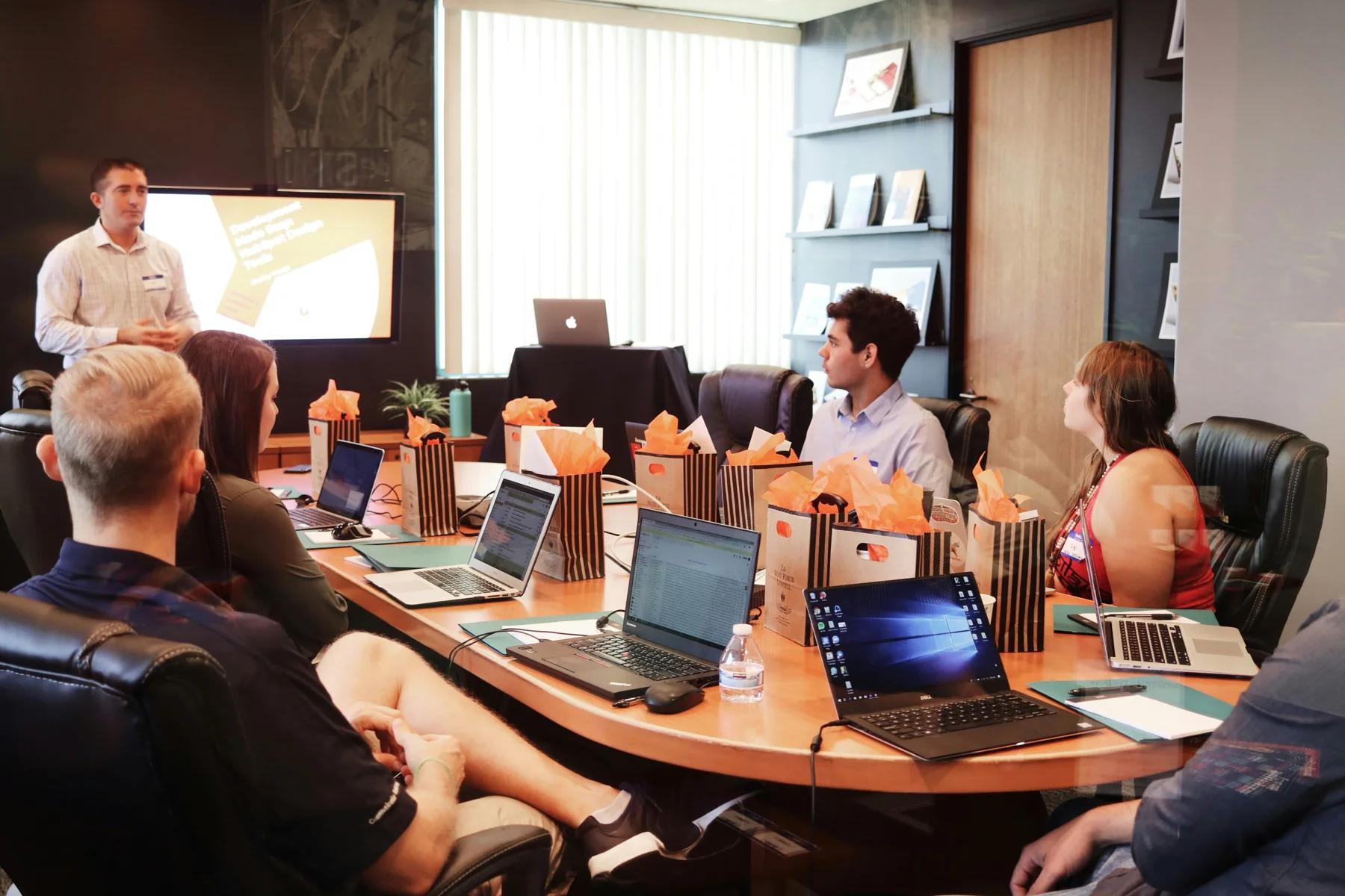 A collaborative workshop with people sharing ideas around a table